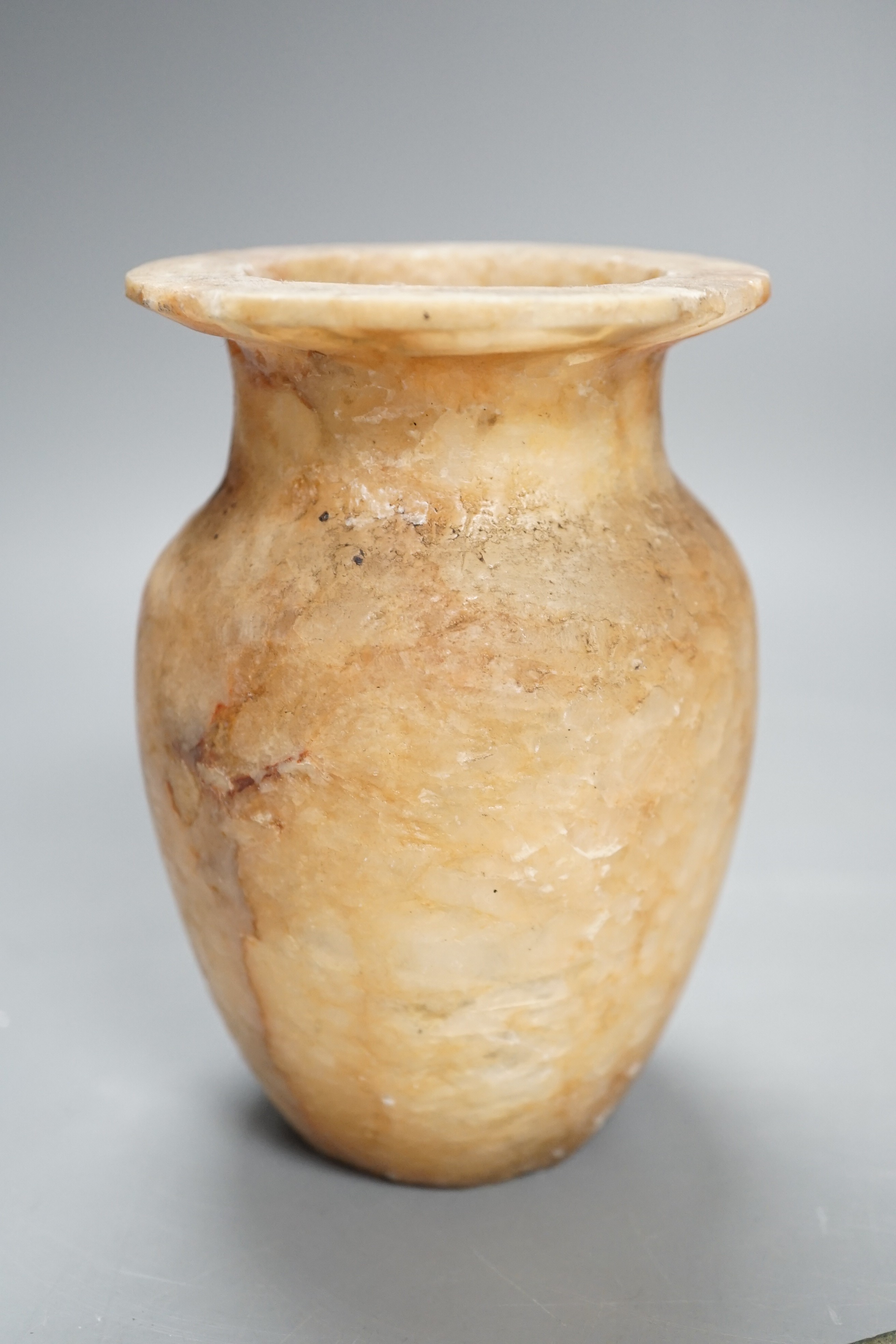 Antiquities to include a Luristan bronze spear head, an Egyptian ushabti (af) and an alabaster jar, spear head 30.5cm long